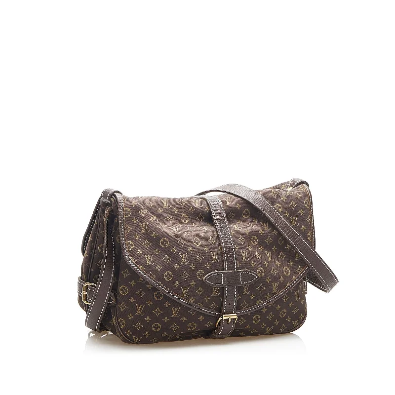 Louis Vuitton bags with a snap - button closure and a decorative charm for styleLouis Vuitton Monogram Mini Lin Saumur 35066)